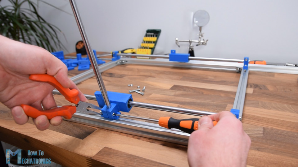 Securing the Y-axis rails on the X-axis sliding block