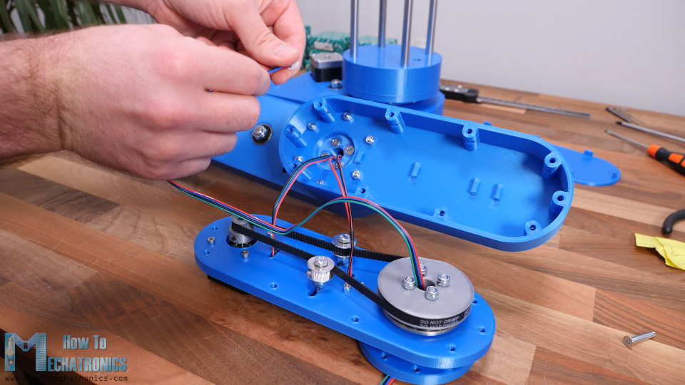 Conducting wires through the hollow robot joints