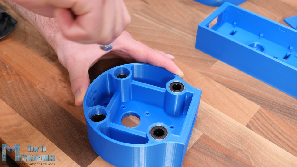 Inserting the linear bearings which will slide on the Z-axis smooth rods