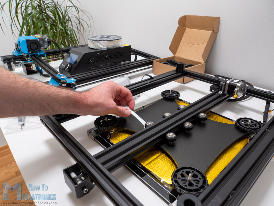 Adjusting the 3D printer bearing wheels using the eccentric nuts