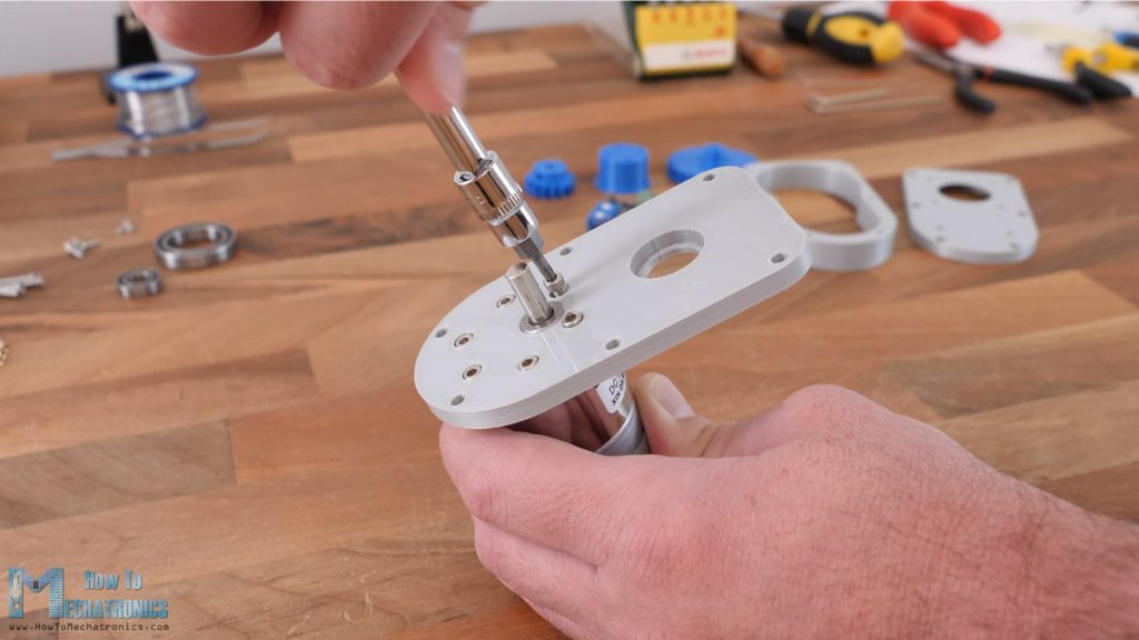 Attaching the DC motor to the gearbox base plate